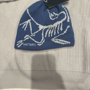 Arc'teryx Blue Knit Beanie with Fish Skeleton Design